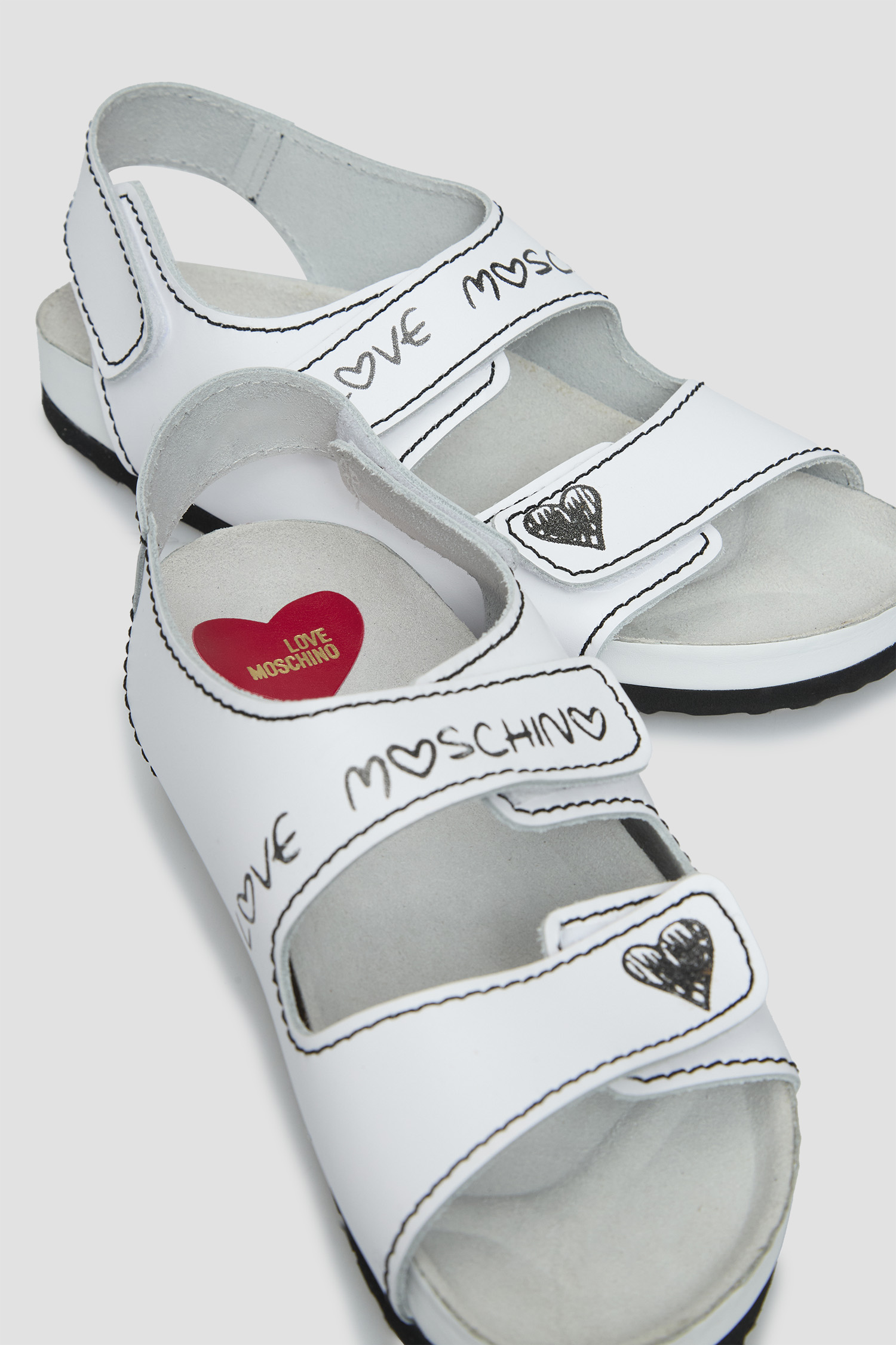 Женские белые кожаные  сандалии Moschino JA16283G0I.IA0;100